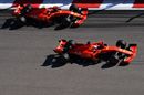 Sebastian Vettel and Charles Leclerc battle for position at the start