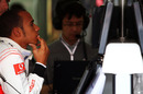 A pensive Lewis Hamilton in the McLaren pits
