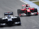 Fernando Alonso follows Rubens Barrichello