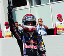 Sebastian Vettel celebrates taking pole position for his home grand prix