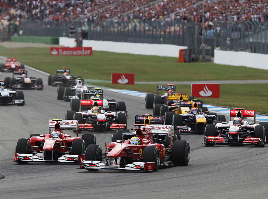 The Ferraris squeeze out Sebastian Vettel at the start of the race