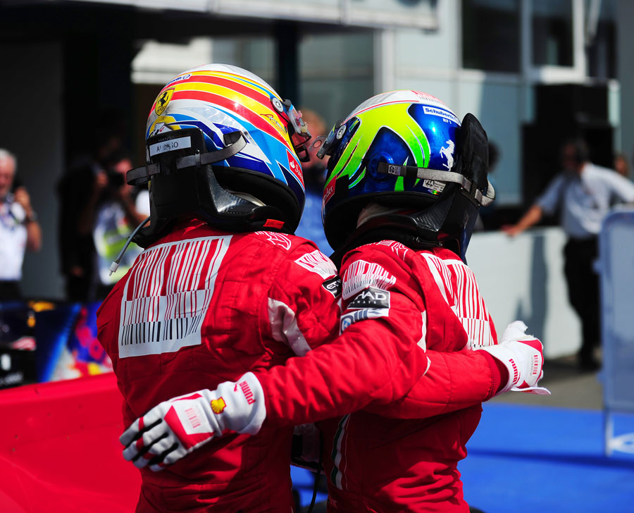 Fernando Alonso consoles Felipe Massa