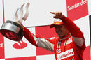 Fernando Alonso with his trophy on the podium