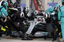 Lewis Hamilton makes a pit stop for new tyres