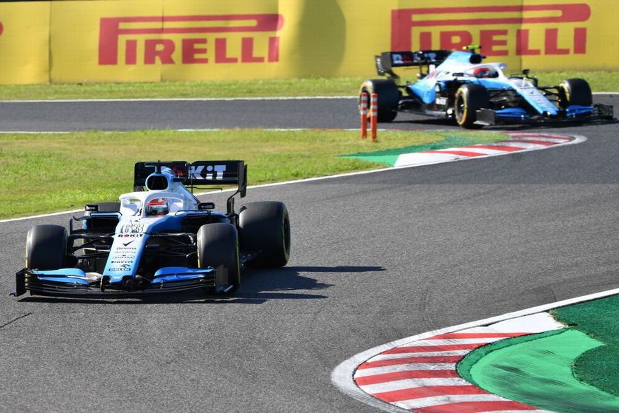 George Russell leads Robert Kubica on track in the Williams
