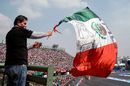 A fan waves a mexican flag