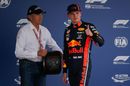 Max Verstappen poses with his pole position award in parc ferme