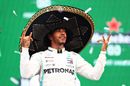Race winner Lewis Hamilton celebrate on the podium