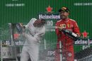 Race winner Lewis Hamilton nd Sebastian Vettel celebrate on the podium with the champagne