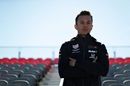 Alexander Albon poses for a photo in a grandstand