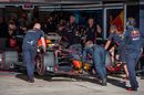 Red Bull mechanics wheel Max Verstappen back into the garage
