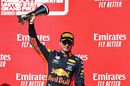 Max Verstappen celebrate on the podium with the trophy