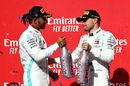 2019 Formula One World Drivers Champion Lewis Hamilton and race winner Valtteri Bottas celebrate on the podium with the champagne