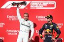 Race winner Valtteri Bottas and Max Verstappen celebrate on the podium