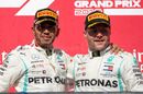2019 Formula One World Drivers Champion Lewis Hamilton and race winner Valtteri Bottas celebrate on the podium