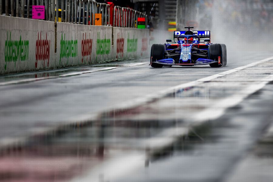 Daniil Kvyat powers down the pit lane in the Toro Rosso
