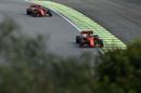 Sebastian Vettel leads Charles Leclerc on track in the Ferrari