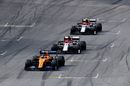 Carlos Sainz Jr leads Kimi Raikkonen and Antonio Giovinazzi on track