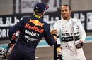 Max Verstappen shakes hands with Lewis Hamilton  in parc ferme