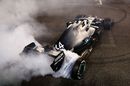 Race winner Lewis Hamilton celebrates with donuts on track
