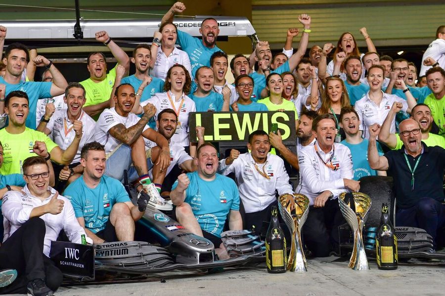 Lewis Hamilton celebrates with his team