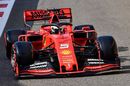 Sebastian Vettel heads down the pit lane in the Ferrari