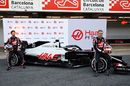 Romain Grosjean and Kevin Magnussen roll out of the Haas VF-20