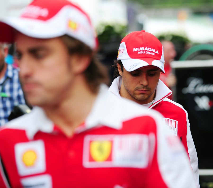 Felipe Massa and Fernando Alonso in the paddock after the race
