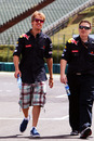 Sebastian Vettel walks the circuit with his race engineer