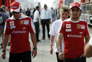 Fernando Alonso and Felipe Massa walk the paddock