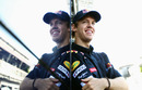 Sebastian Vettel reflects against the side of the motorhome