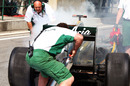 Jarno Trulli suffers a small fire in the pits