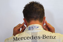 Michael Schumacher blocks out the engine noise
