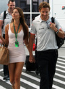 Jessica Michibata accompanies boyfriend Jenson Button in the paddock