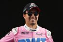 Sergio Perez poses for a photo in the Paddock