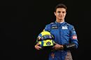 Lando Norris poses for a photo in the Paddock