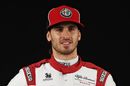 Antonio Giovinazzi poses for a photo in the Paddock