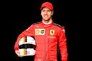 Sebastian Vettel poses for a photo in the Paddock