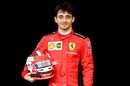 Charles Leclerc poses for a photo in the Paddock
