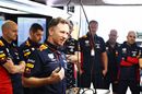 Christian Horner talks with the Red Bull team in the garage