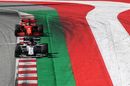 Daniil Kvyat leads Sebastian Vettel on track
