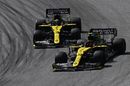 Esteban Ocon battles for position with Daniel Ricciardo on track in the Renault