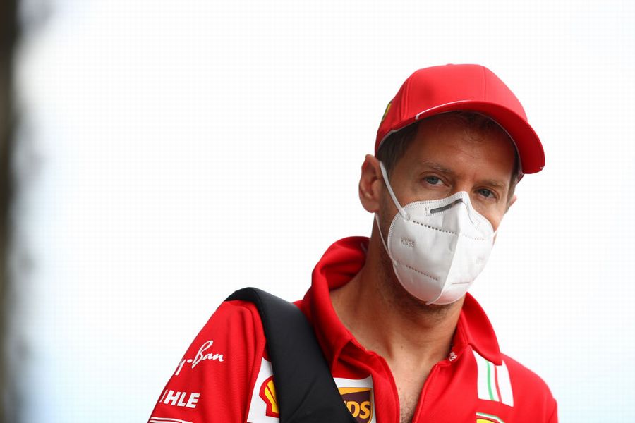 Sebastian Vettel arrives in the paddock