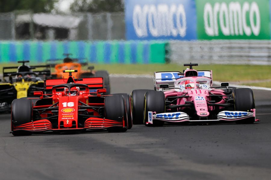 Charles Leclerc and Sergio Perez battle for position