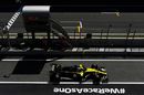 Daniel Ricciardo powers down the pit lane in the Renault