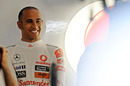 A relaxed Lewis Hamilton in the McLaren pits