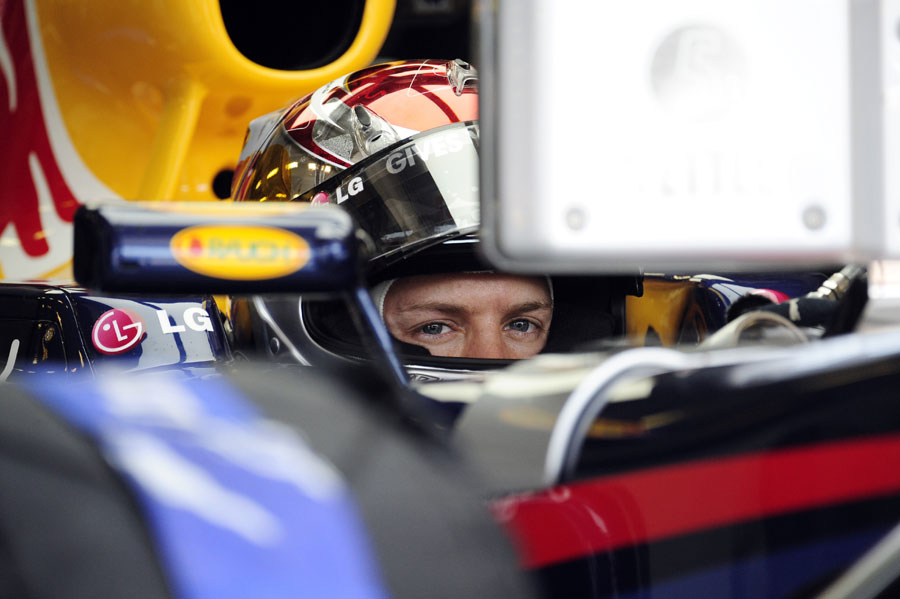 Sebastian Vettel studies the lap times