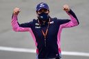 Sergio Perez gestures as he walks the track