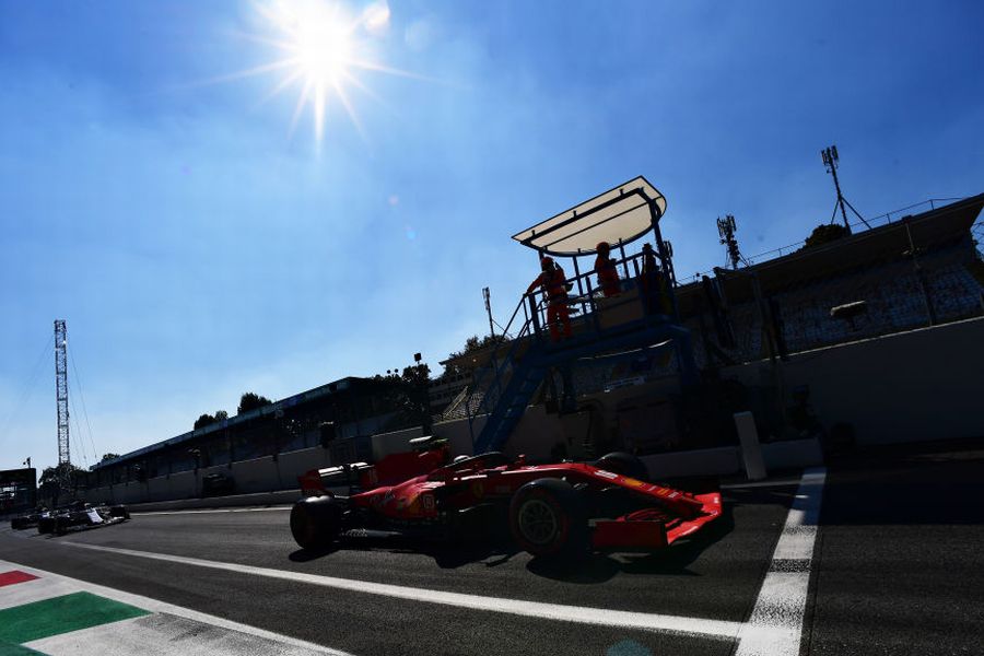 Charles Leclerc heads down the pit lane in the Ferrari