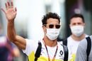 Daniel Ricciardo waves in the Paddock